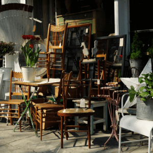 Assorted furniture and flowers on sidewalk